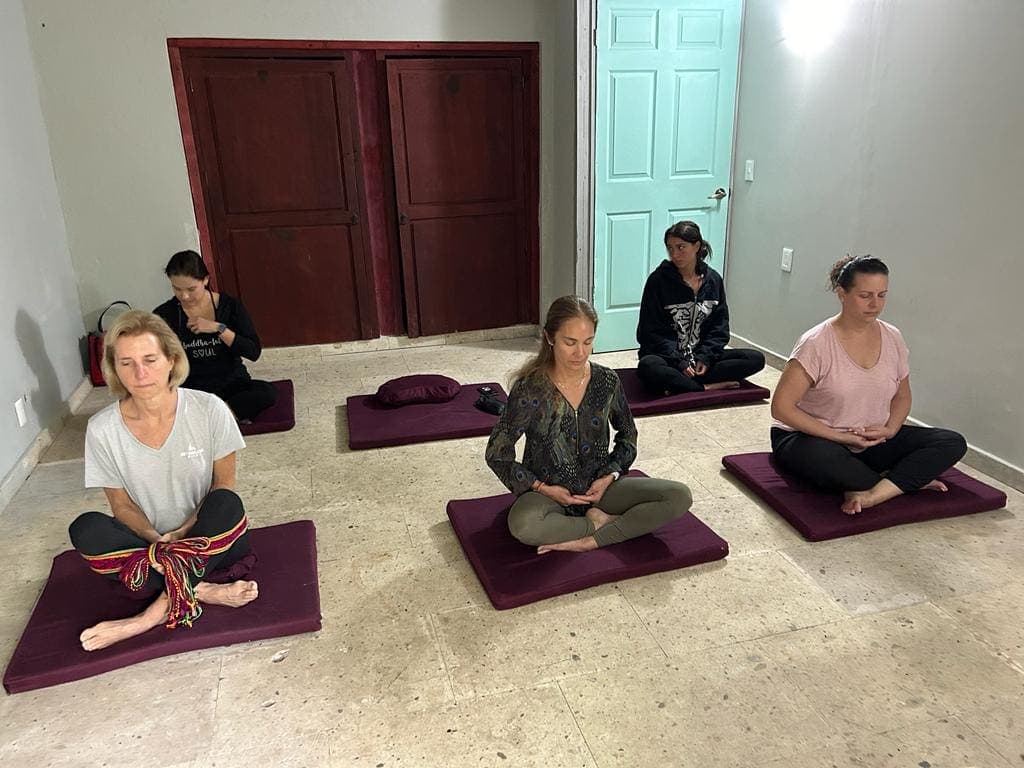 A guided meditation session on floor cushions