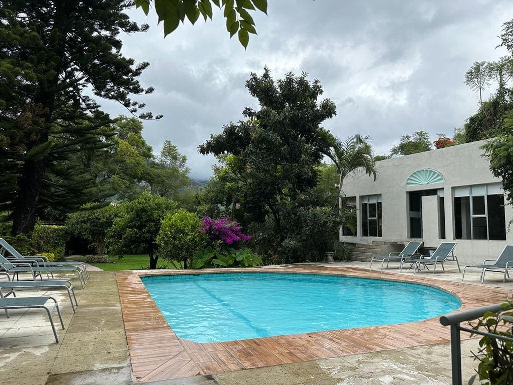 The pool at Casa Tepoztlán surrounded by gardens