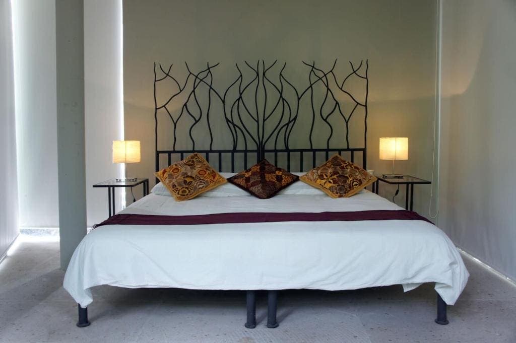 King room with handcrafted headboard