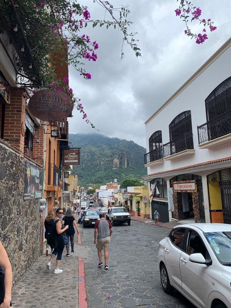 A Tepoztlán street with the Tepozteco mountain rising behind it